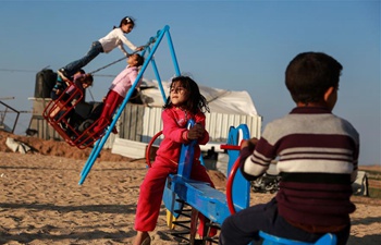 Palestinian children play near border between Israel, Gaza Strip